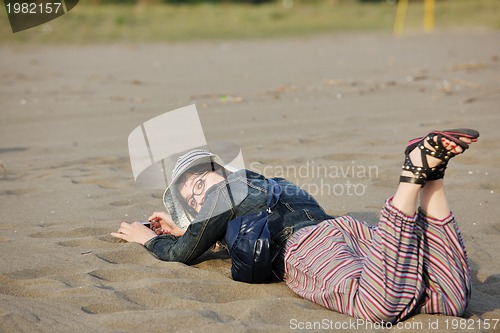 Image of young woman relax  on beach