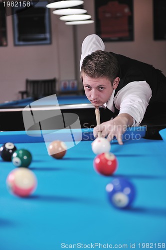 Image of young man play pro billiard game 