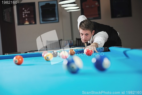 Image of young man play pro billiard game 