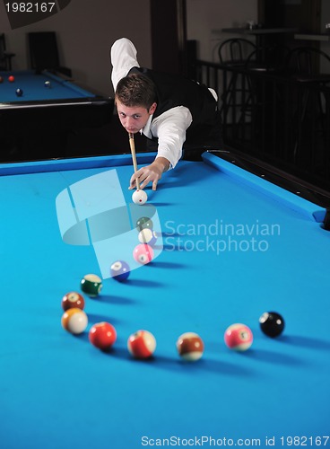 Image of young man play pro billiard game 