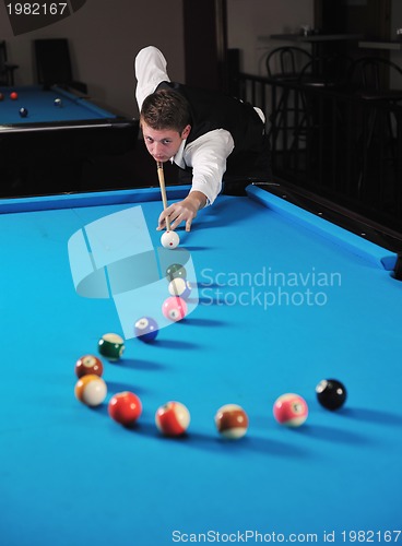 Image of young man play pro billiard game 