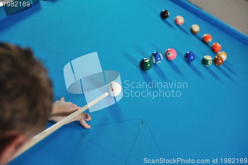 Image of young man play pro billiard game 