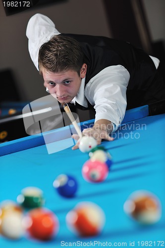 Image of young man play pro billiard game 