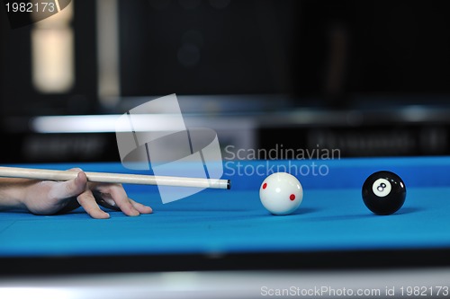 Image of young man play pro billiard game 