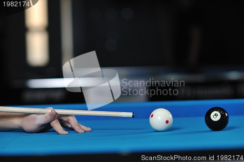 Image of young man play pro billiard game 