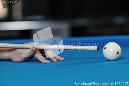 Image of young man play pro billiard game 