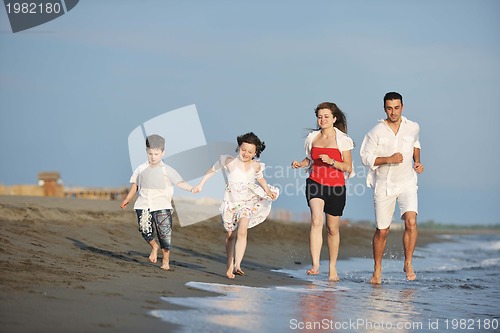 Image of happy young family have fun on beach