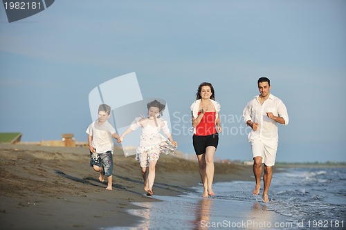 Image of happy young family have fun on beach