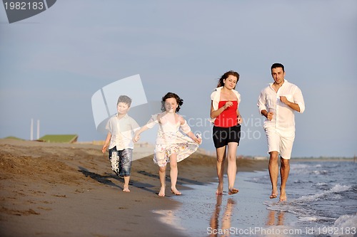 Image of happy young family have fun on beach