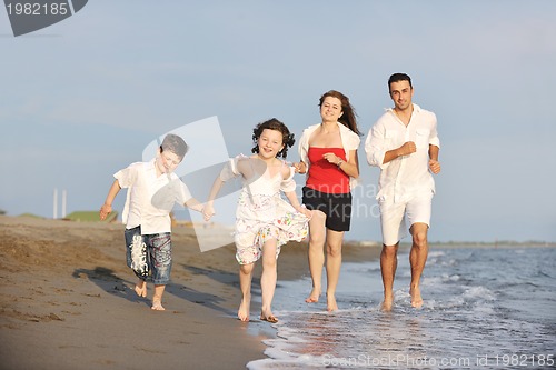 Image of happy young family have fun on beach