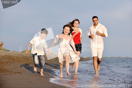 Image of happy young family have fun on beach