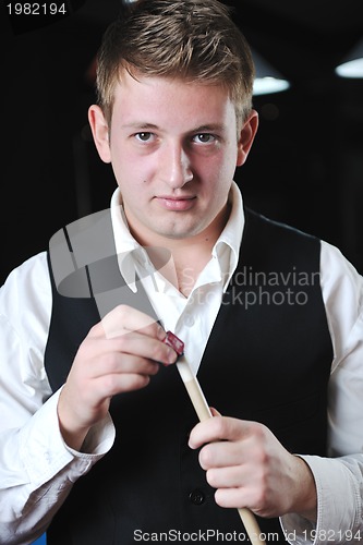 Image of young man play pro billiard game 