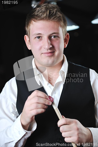 Image of young man play pro billiard game 