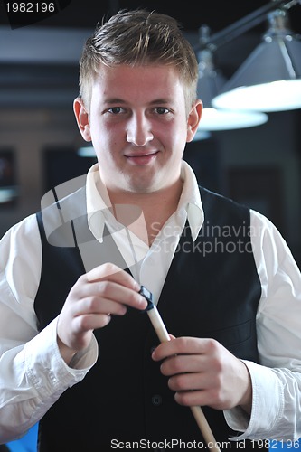 Image of young man play pro billiard game 