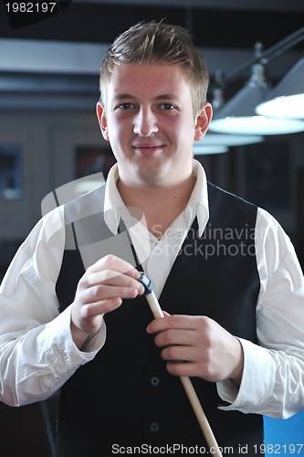 Image of young man play pro billiard game 