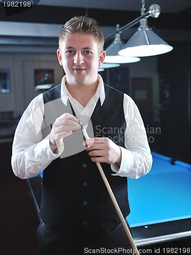 Image of young man play pro billiard game 