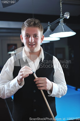 Image of young man play pro billiard game 