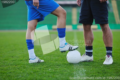 Image of football players in competition for the ball