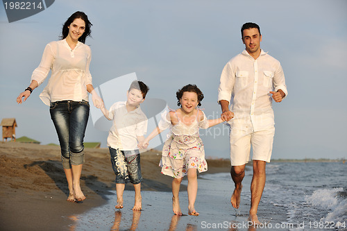 Image of happy young family have fun on beach