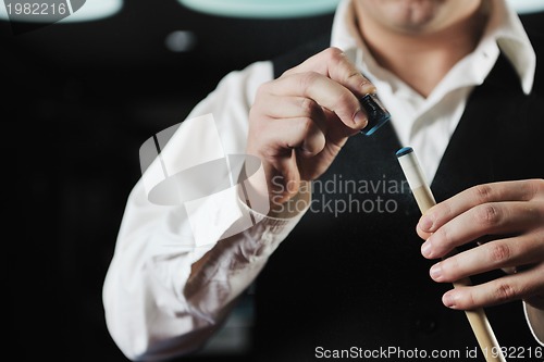 Image of young man play pro billiard game 