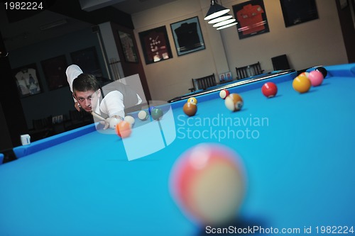 Image of young man play pro billiard game 