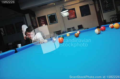 Image of young man play pro billiard game 