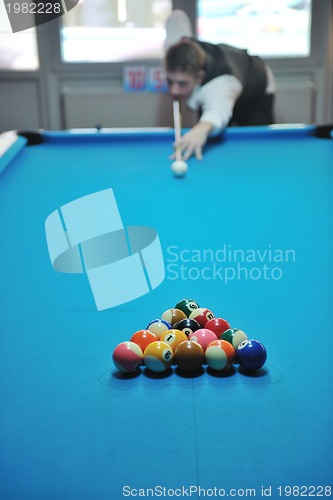 Image of young man play pro billiard game 