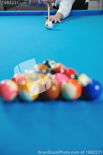 Image of young man play pro billiard game 