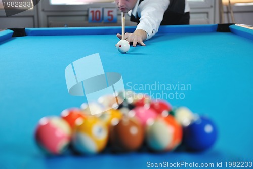 Image of young man play pro billiard game 