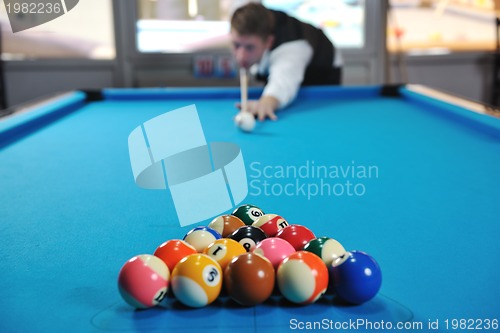 Image of young man play pro billiard game 