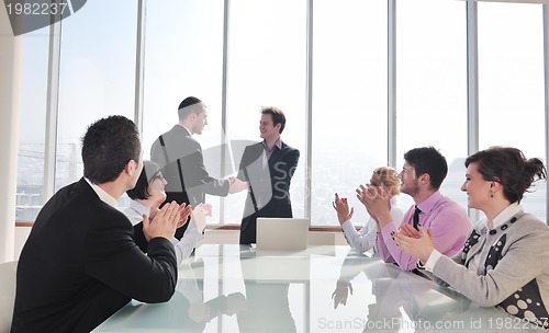 Image of group of business people at meeting