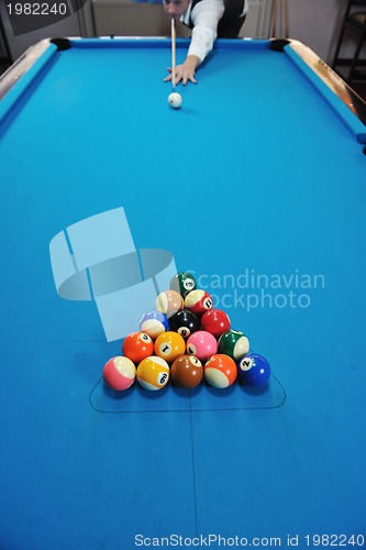 Image of young man play pro billiard game 