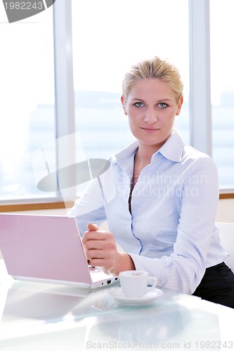 Image of young business woman on meeting