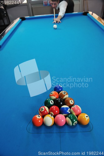 Image of young man play pro billiard game 