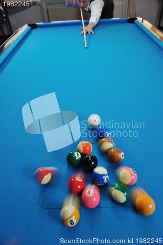 Image of young man play pro billiard game 