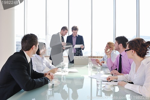 Image of group of business people at meeting