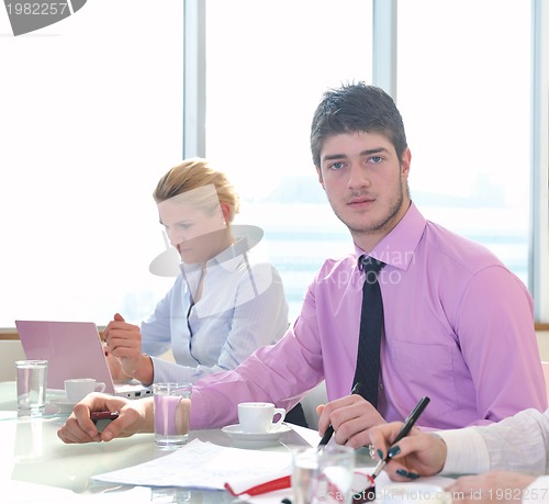 Image of group of business people at meeting