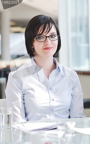 Image of young business woman on meeting