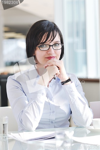 Image of young business woman on meeting