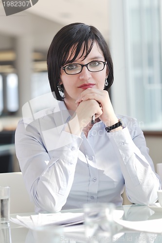 Image of young business woman on meeting