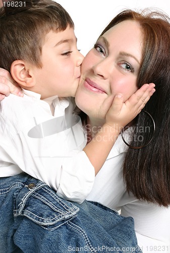 Image of Child giving mother a kiss