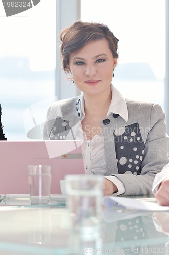Image of young business woman on meeting