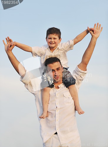 Image of happy young family have fun on beach