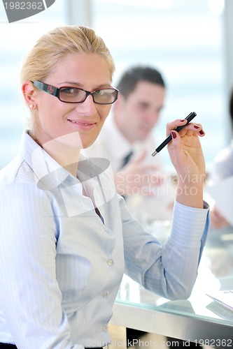 Image of young business woman on meeting