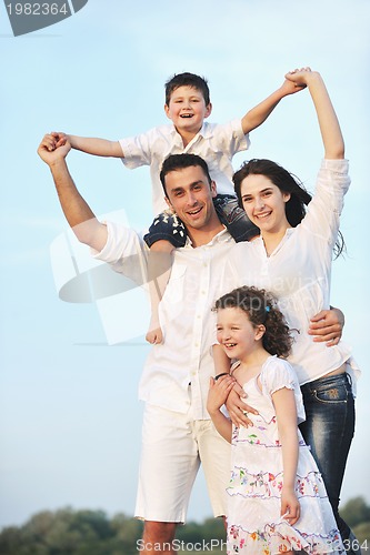 Image of happy young family have fun on beach