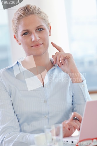 Image of young business woman on meeting