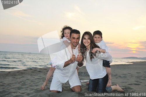 Image of happy young family have fun on beach