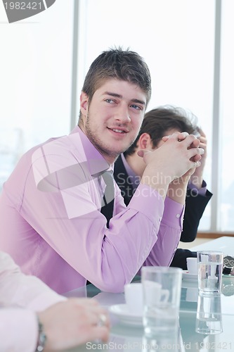 Image of group of business people at meeting