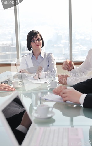 Image of group of business people at meeting