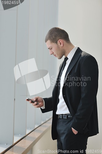 Image of young business man talk by cellphone